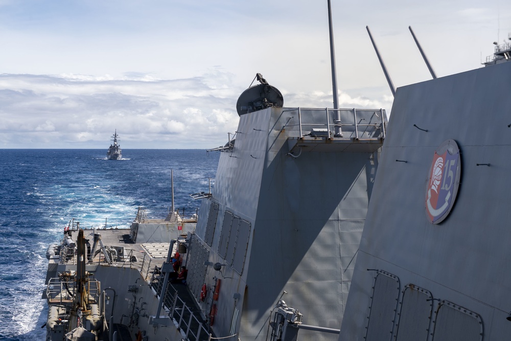 Arleigh Burke-class guided-missile destroyer USS Rafael Peralta (DDG 115) conducts joint operations with Japanese Maritime Self Defense Force Takanami-class destroyer JS Makinami (DD 112)