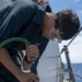 Seaman Isiah Jackson, from San Diego, Calif., conducts ship preservation