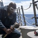 Seaman Jonathan Taylor, from Killeen, Texas, conducts ship preservation