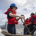 Operations Specialist Seaman Apprentice Abigail Dalton, from Dayton, Ohio, heaves a line