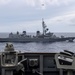 USS Rafael Peralta (DDG 115) sails alongside Japanese Maritime Self Defense Force Takanami-class destroyer JS Makinami (DD 112)