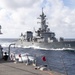 USS Rafael Peralta (DDG 115) sails alongside Japanese Maritime Self Defense Force Takanami-class destroyer JS Makinami (DD 112)