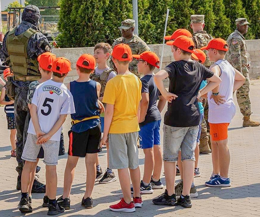 Deployed US Soldiers support community during a local youth event in Poland