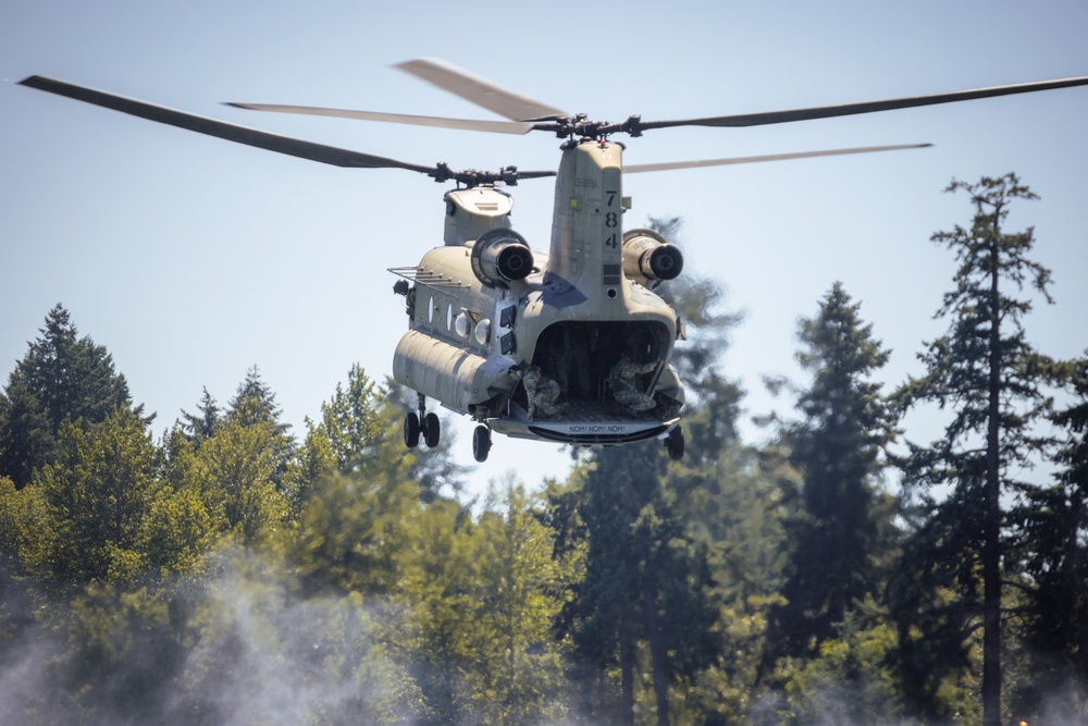 Crew members conduct checks before soldiers make their jump