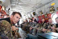 Members of the Washington Army National Guard, and Oregon Army National Guard standby, as they approach the jump zone [Image 3 of 11]