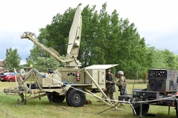 Michigan National Guard Soldiers set up satellite communications during annual training