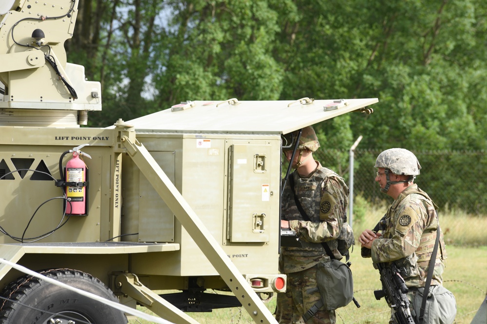 Michigan National Guard Soldiers set up satellite communications during annual training