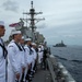 Sailors man the rails during a remembrance ceremony for the Solomon Islands campaign with Japanese Maritime Self Defense Force Takanami-class destroyer JS Makinami (DD 112)