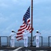 Sailors render honors during a remembrance ceremony for the Solomon Islands campaign