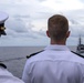 Cmdr. J.J. Murawski (left), commanding officer of USS Rafael Peralta (DDG 115), prepares for a remembrance ceremony for the Solomon Islands campaign with Japanese Maritime Self Defense Force Takanami-class destroyer JS Makinami (DD 112)