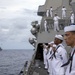 Sailors man the rails during a remembrance ceremony for the Solomon Islands campaign with Japanese Maritime Self Defense Force Takanami-class destroyer JS Makinami (DD 112)