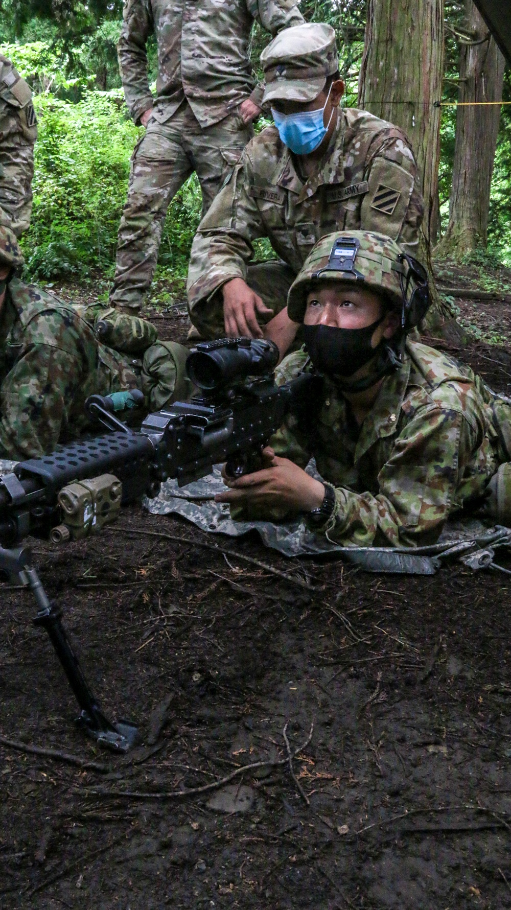 U.S. and Japanese forces train on weapon skills together during Orient Shield 21-2