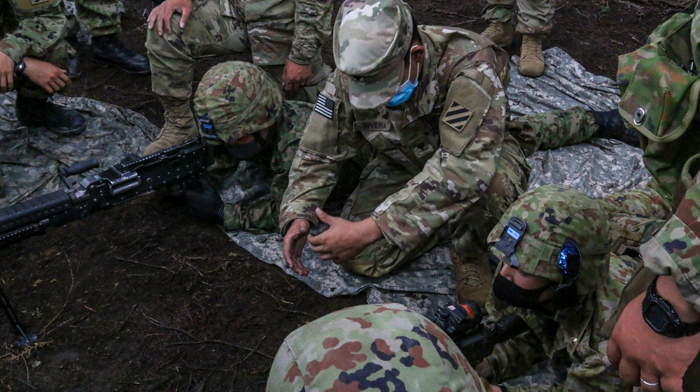U.S. and Japanese forces train on weapon skills together during Orient Shield 21-2