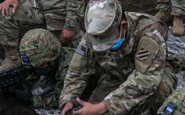 U.S. and Japanese forces train on weapon skills together during Orient Shield 21-2