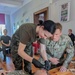 Deployed US Soldiers teach CLS class to Polish high school