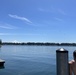 Curious onlookers observe airborne U.S. Army Rangers above American Lake