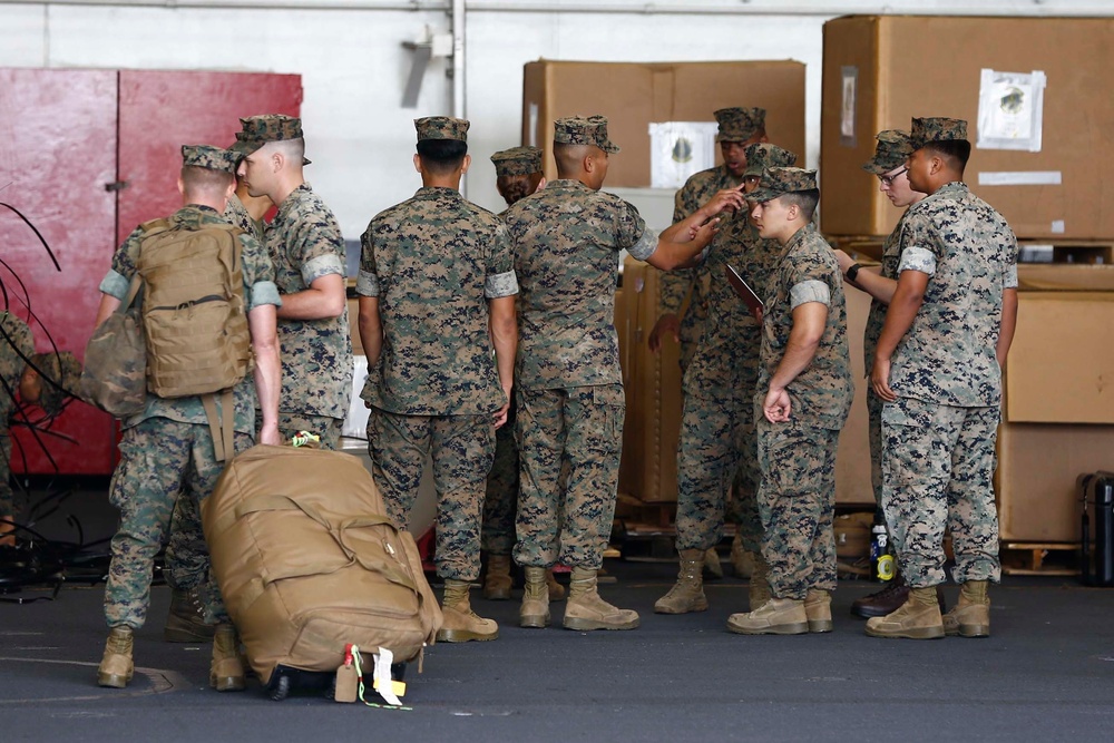 VMFA-314 Unload gear aboard USS Abraham Lincoln