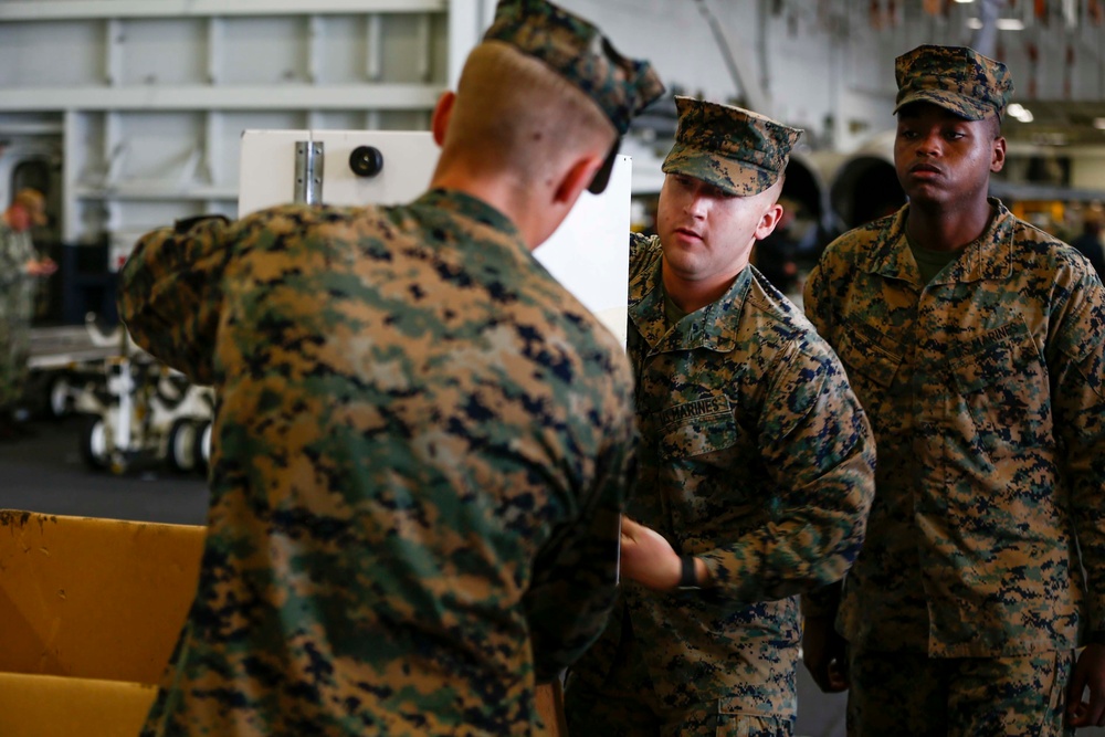 VMFA-314 Unload gear aboard USS Abraham Lincoln