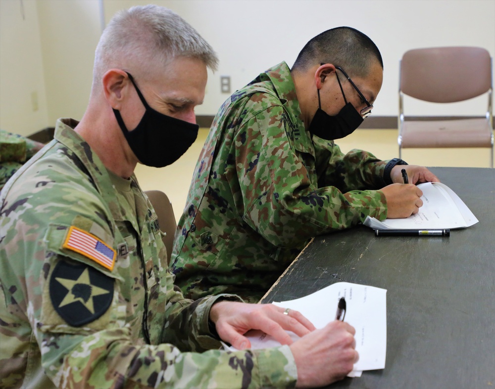 USARJ G3 and JGSDF 4th Field Artillery Group commander sign the memorandum of agreement for live fire during Orient Shield 21-2
