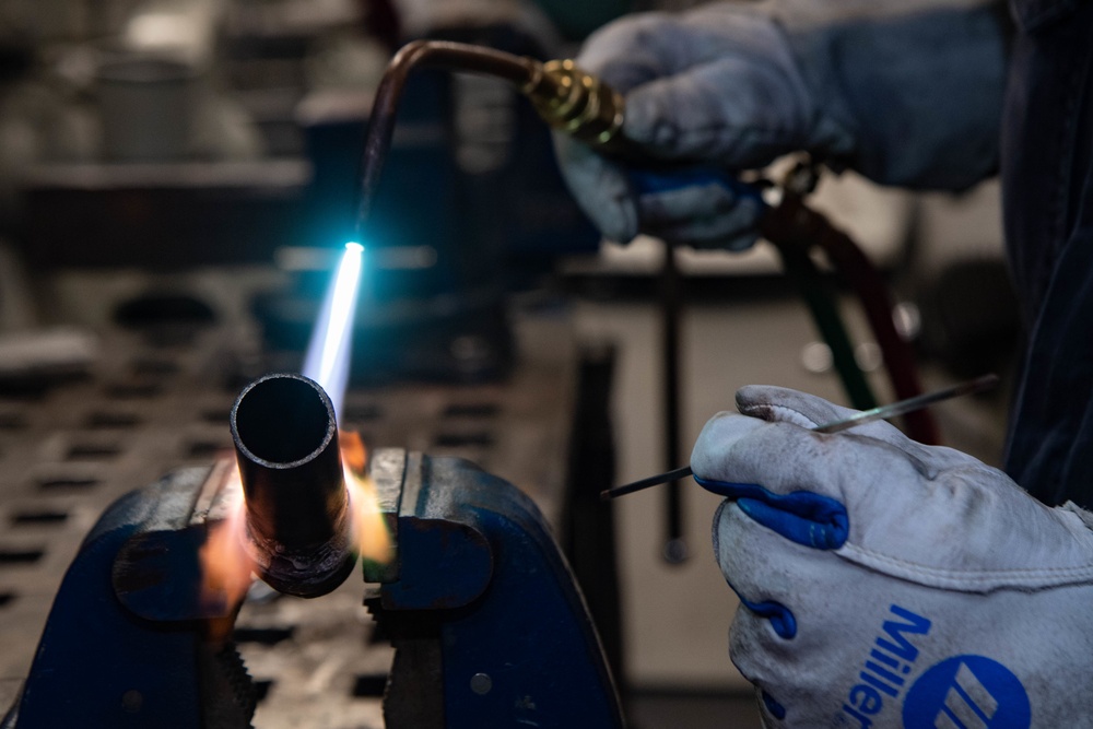 USS Kidd Hull Technician Repairs Pipe