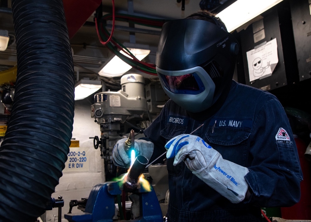 USS Kidd Hull Technician Repairs Pipe