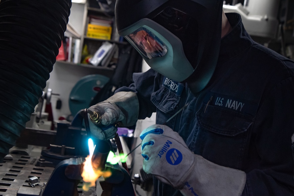 USS Kidd Hull Technician Repairs Pipe