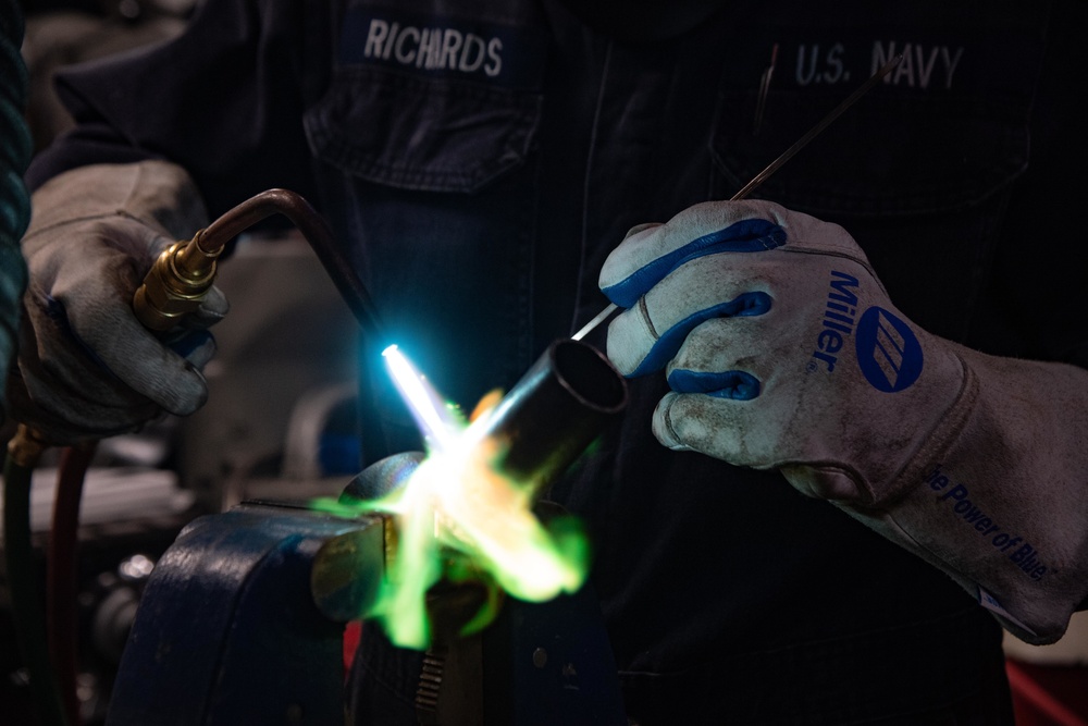 USS Kidd Hull Technician Repairs Pipe