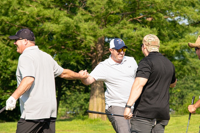 Community and Airmen come together to golf for a cause