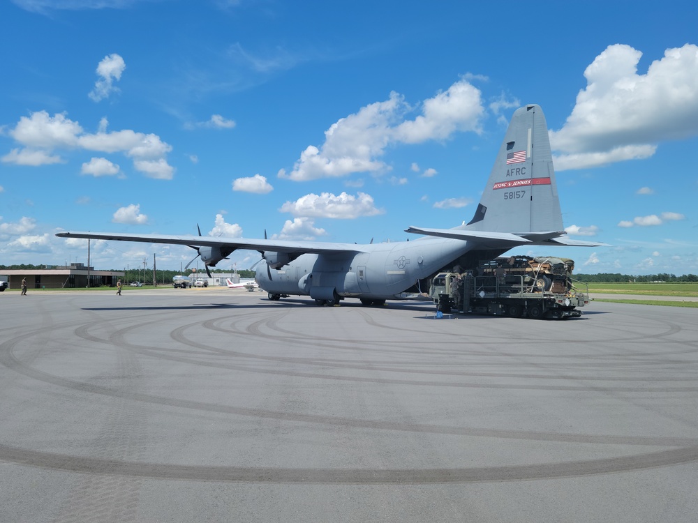 815th AS kicking up dust; letting cargo, personnel drop