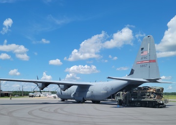 815th AS kicking up dust; letting cargo, personnel drop