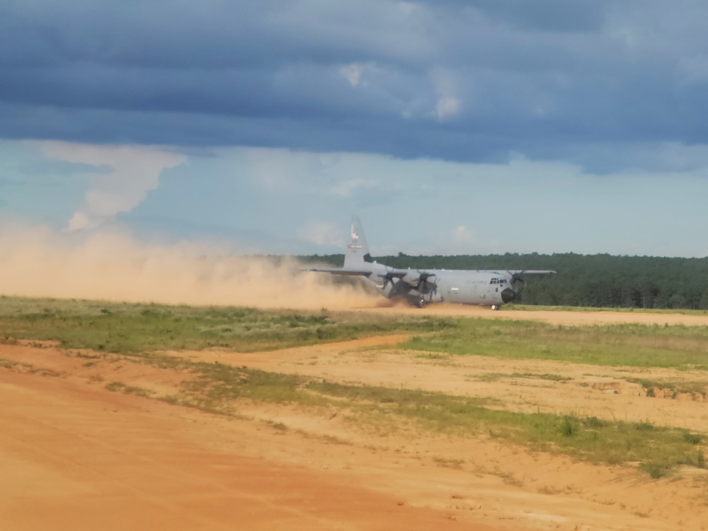 815th AS kicking up dust; letting cargo, personnel drop