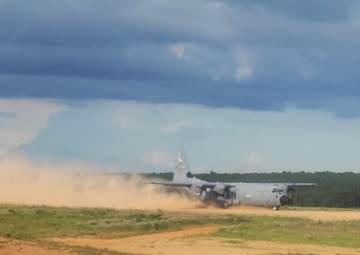 815th AS kicking up dust; letting cargo, personnel drop