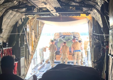 815th AS kicking up dust; letting cargo, personnel drop