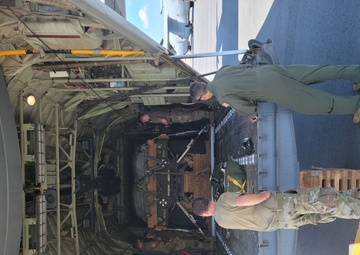 815th AS kicking up dust; letting cargo, personnel drop