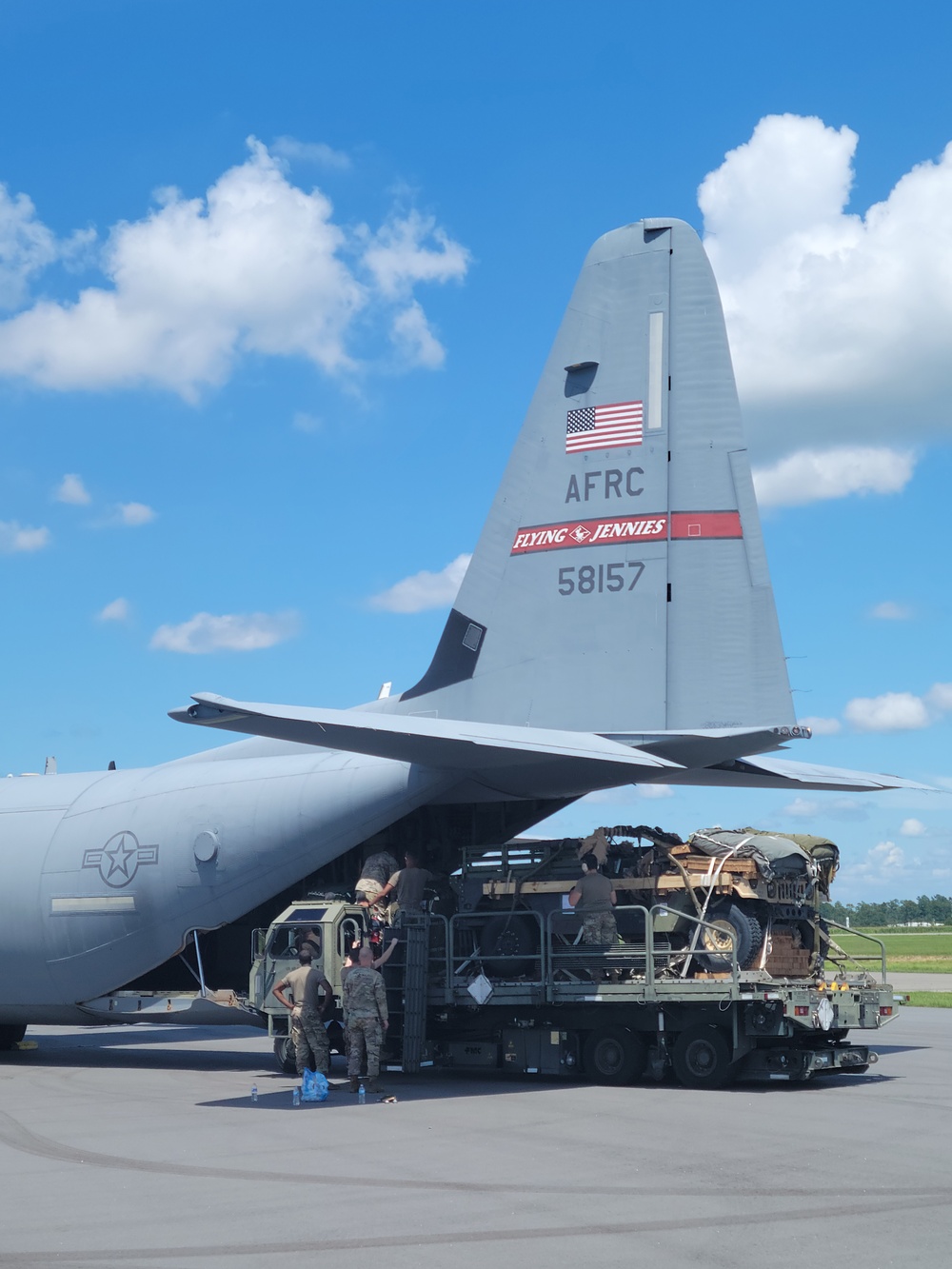 815th AS kicking up dust; letting cargo, personnel drop