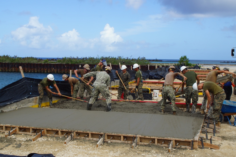 NMCB 4 and 7th ESB place concrete pads at Port of Tinian