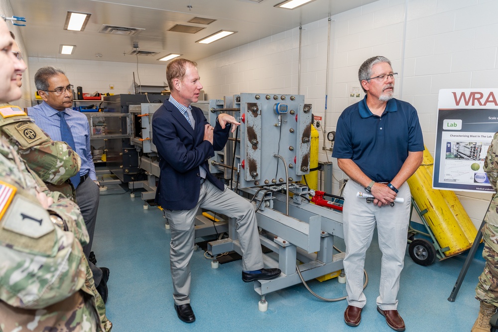 Interim Dean of Uniformed Services University School of Medicine, Captain Eric Elster, Visits Walter Reed Army Institute of Research