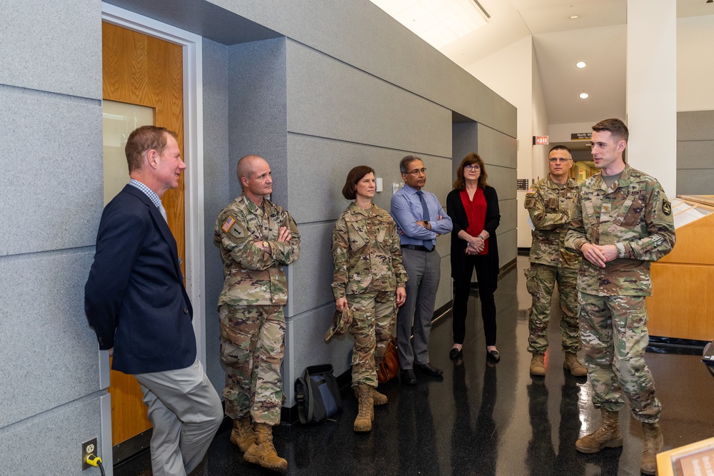 Interim Dean of Uniformed Services University School of Medicine, Captain Eric Elster, Visits Walter Reed Army Institute of Research