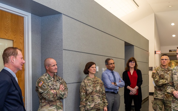 Interim Dean of Uniformed Services University School of Medicine, Captain Eric Elster, Visits Walter Reed Army Institute of Research