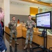 Interim Dean of Uniformed Services University School of Medicine, Captain Eric Elster, Visits Walter Reed Army Institute of Research