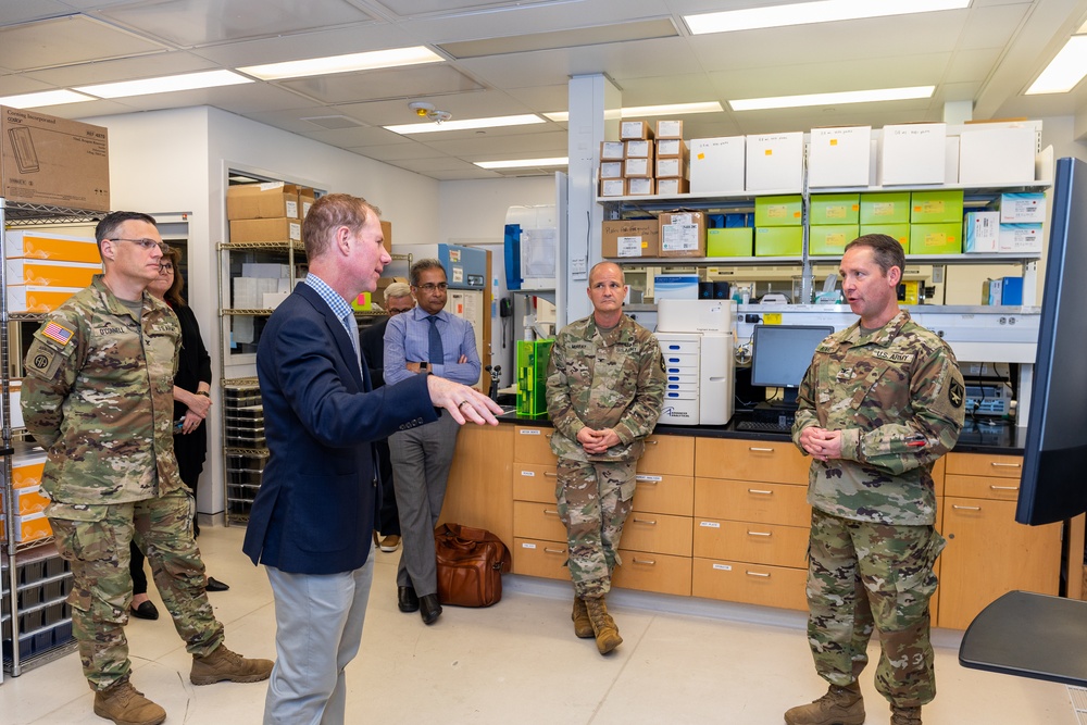 Interim Dean of Uniformed Services University School of Medicine, Captain Eric Elster, Visits Walter Reed Army Institute of Research