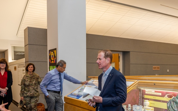 Interim Dean of Uniformed Services University School of Medicine, Captain Eric Elster, Visits Walter Reed Army Institute of Research