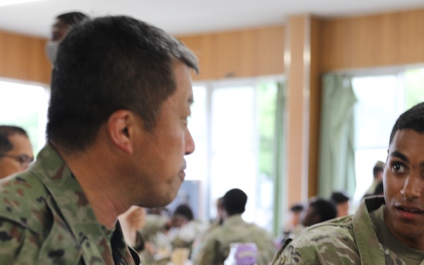 Dogface Soldiers and Japan Ground Self-Defense Force members enjoy dinner together during Orient Shield 21-2