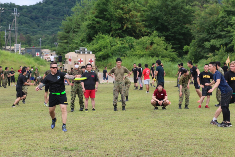 Black Lions and Japan Ground Self-Defense Force members take a break from training to compete in ultimate Frisbee tournament
