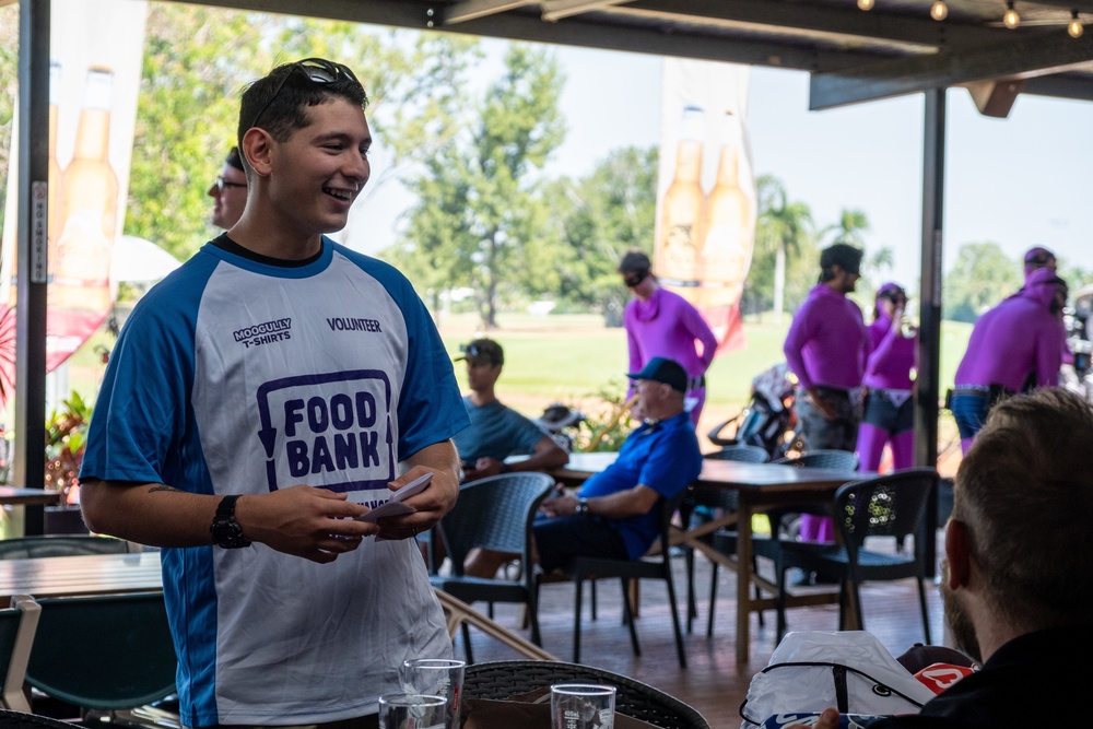 U.S. Marines and Sailors with MRF-D volunteer at a golf charity event