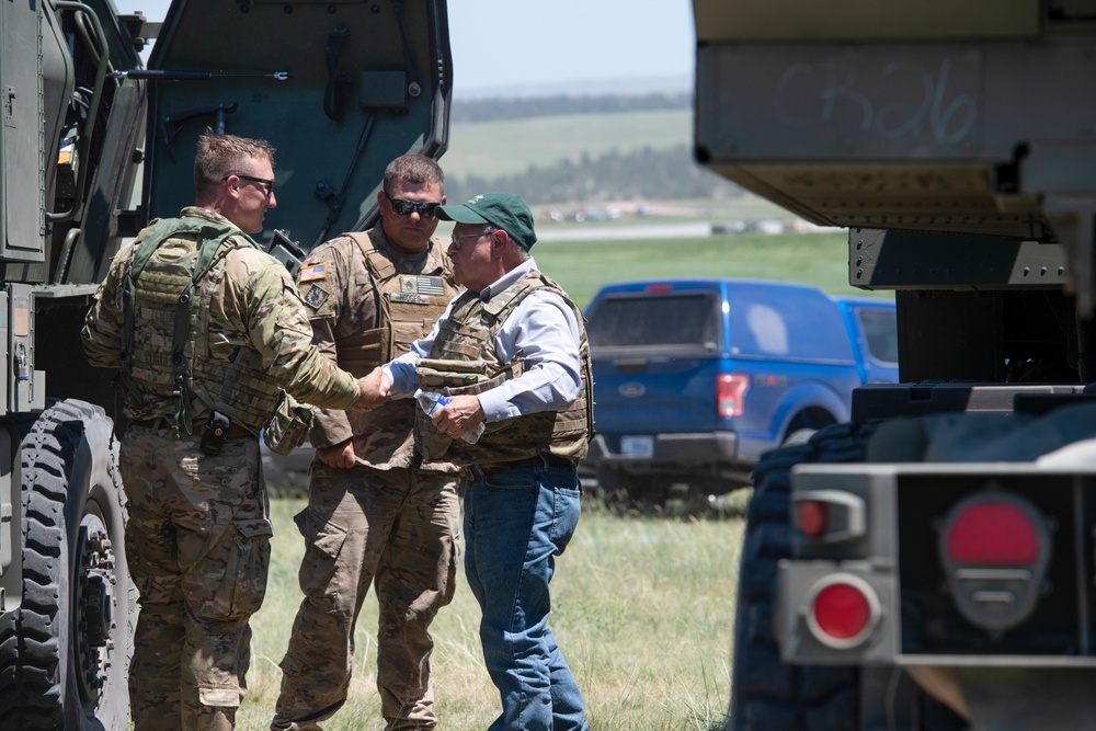 Wyoming Governor Mark Gordon and other distinguished guests visit the Camp Guernsey training area to experience a live-fire exercise with the Wyoming Army National Guard