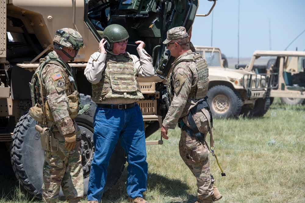 Wyoming Governor Mark Gordon and other distinguished guests visit the Camp Guernsey training area to experience a live-fire exercise with the Wyoming Army National Guard