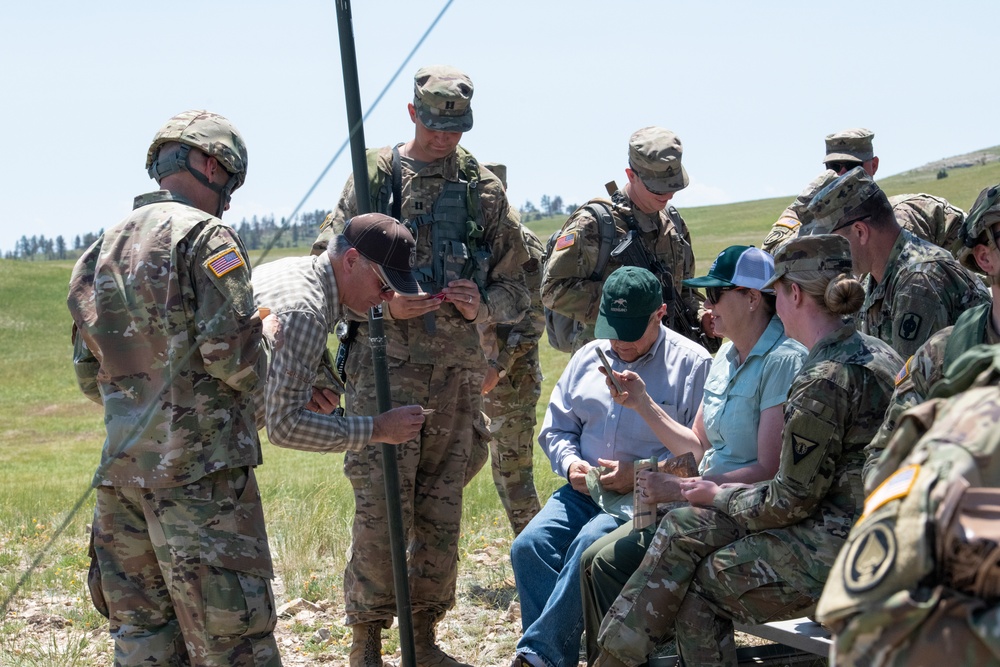 Wyoming Governor Mark Gordon and other distinguished guests visit the Camp Guernsey training area to experience a live-fire exercise with the Wyoming Army National Guard