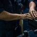 USS Carl Vinson (CVN 70) Sailors inspect weapons