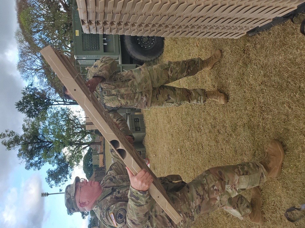 412th TEC Soldiers move building supplies during annual exercise.